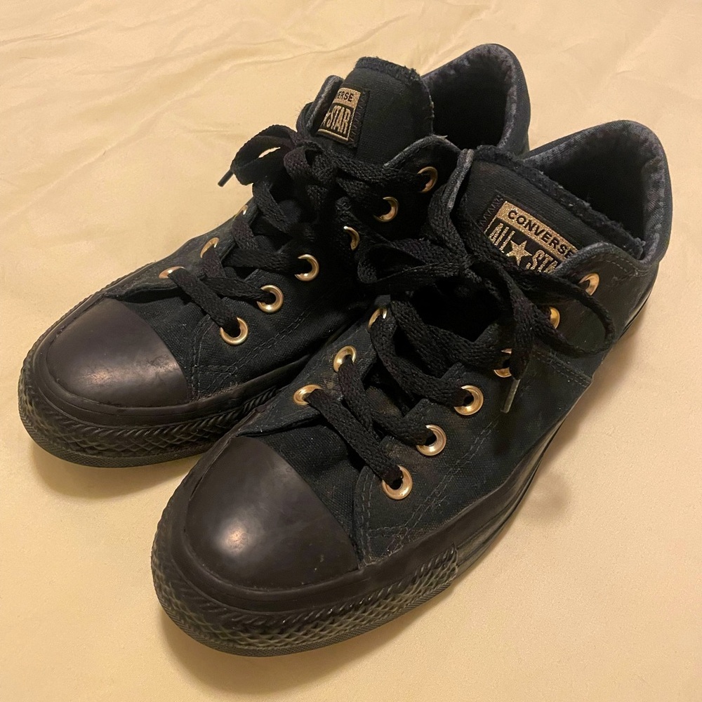 Low Top Black and Gold Converse.